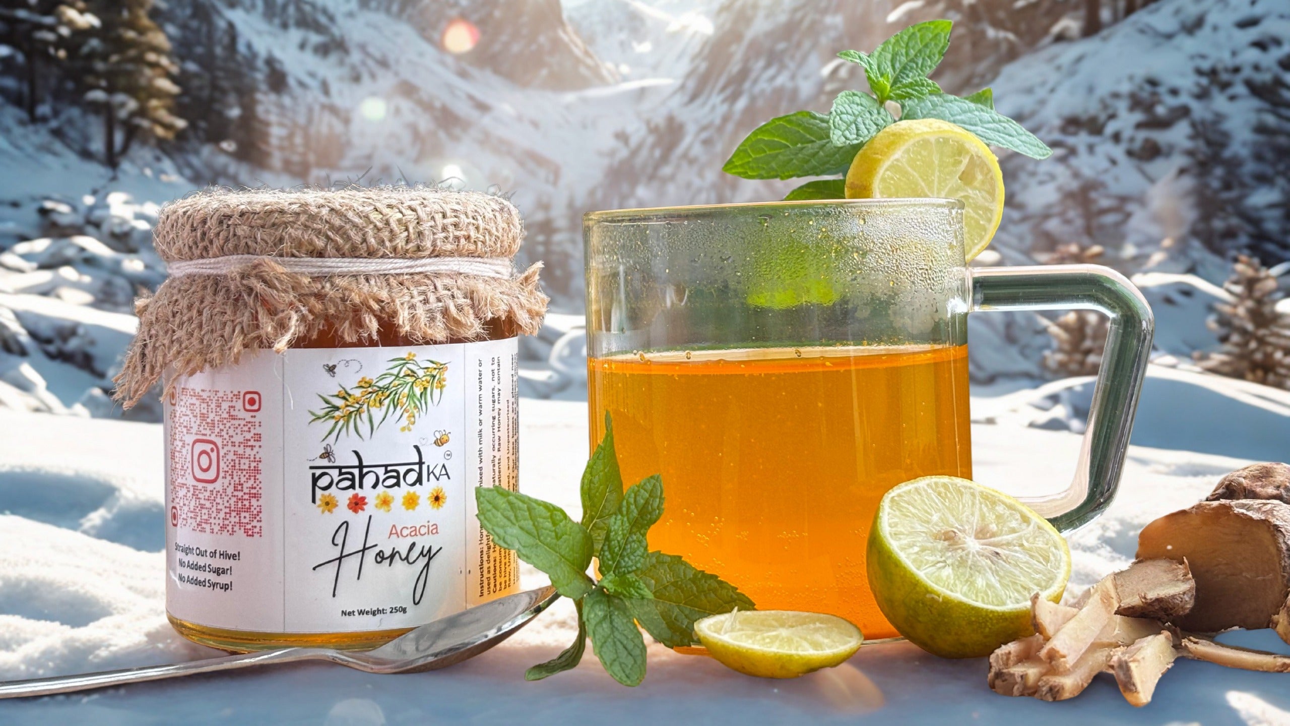 Jar of honey and mug of tea with lemon and mint on a snowy background